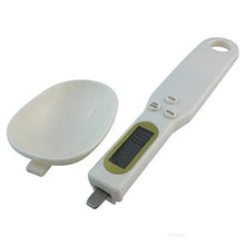 Digital spoon scale in use for baking measurements